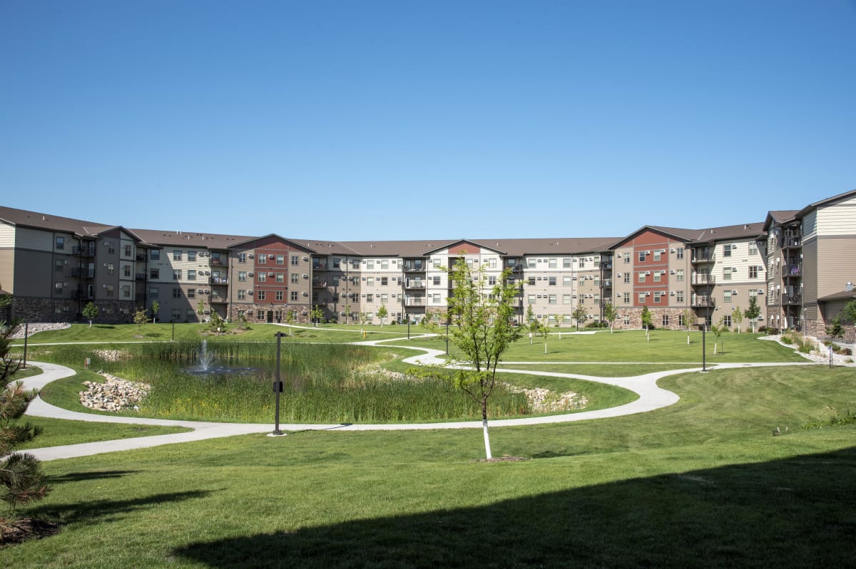 Cardinal Point Apartments courtyard with fountain and paths - Grand Forks, ND