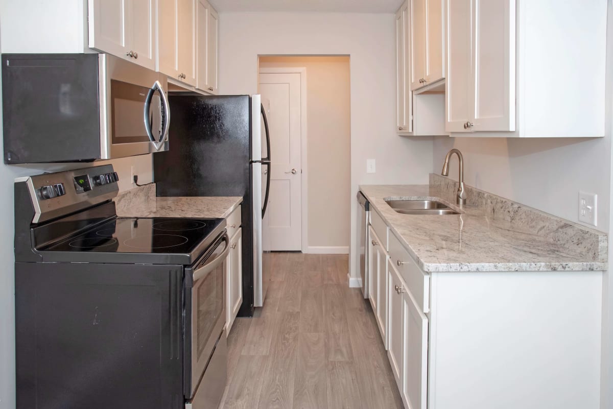 Connelly On Eleven kitchen and dining with wood-look vinyl flooring - Burnsville, MN