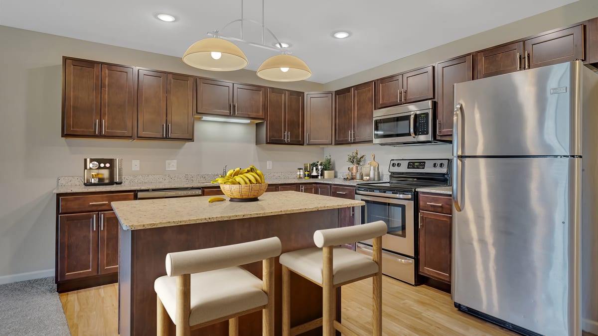 Monticello Crossings modern kitchen with stainless steel appliances - Monticello, MN