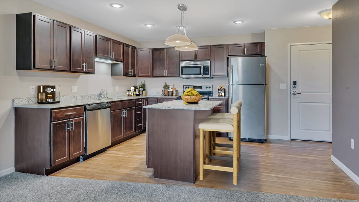 Monticello Crossings kitchen with stainless appliances and cabinetry - Monticello, MN
