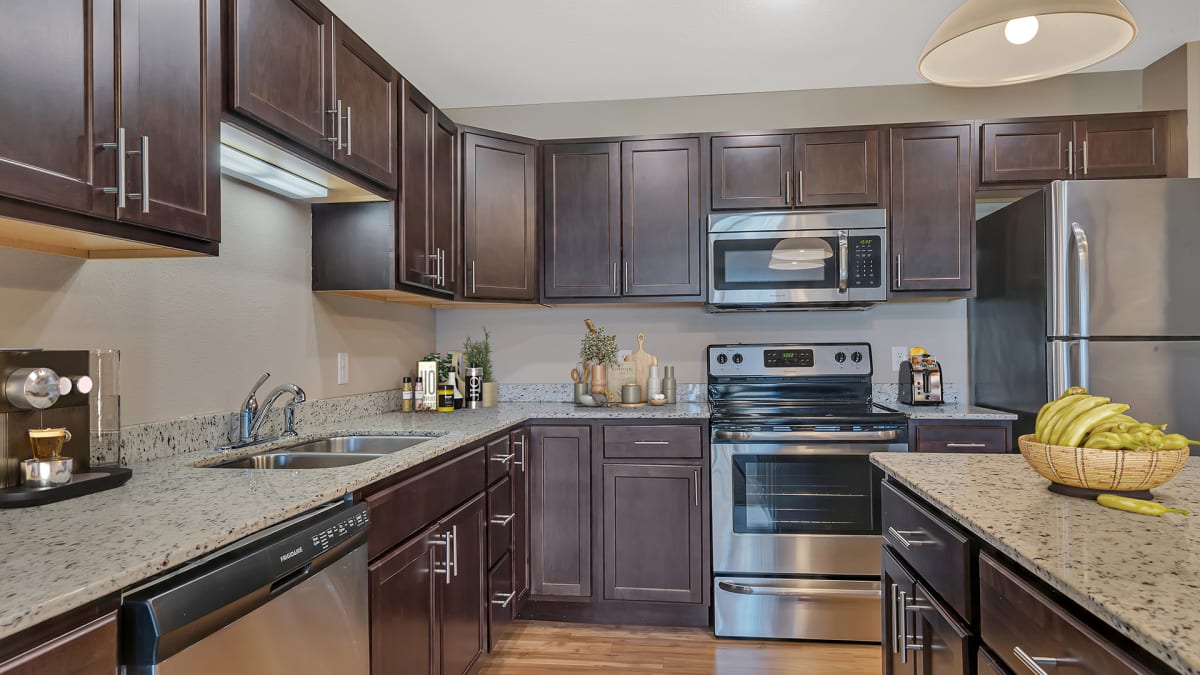 Monticello Crossings modern kitchen with granite countertops - Monticello, MN
