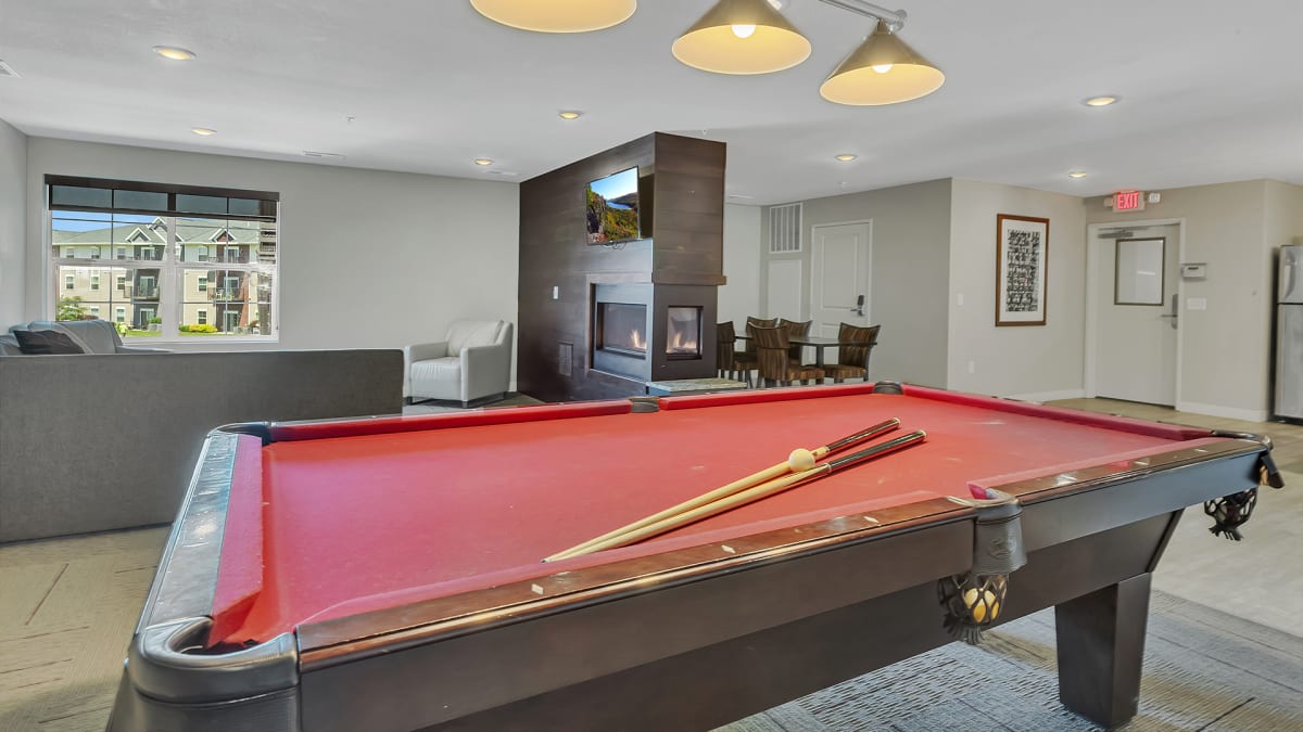 Monticello Crossings game room with pool table and fireplace - Monticello, MN