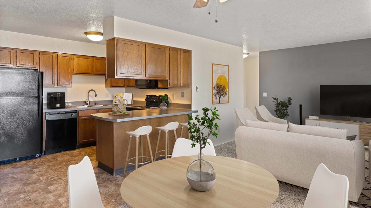 Olympic Village Apartments kitchen, dining, and living room - Billings, MT