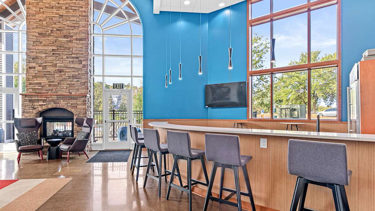 Park Place Apartments clubhouse lounge with fireplace - Plymouth, MN