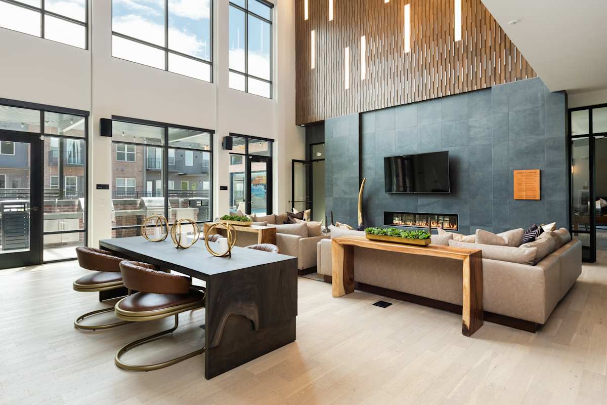 Railway Flats Apartments fireplace lounge with workspaces - Loveland, CO
