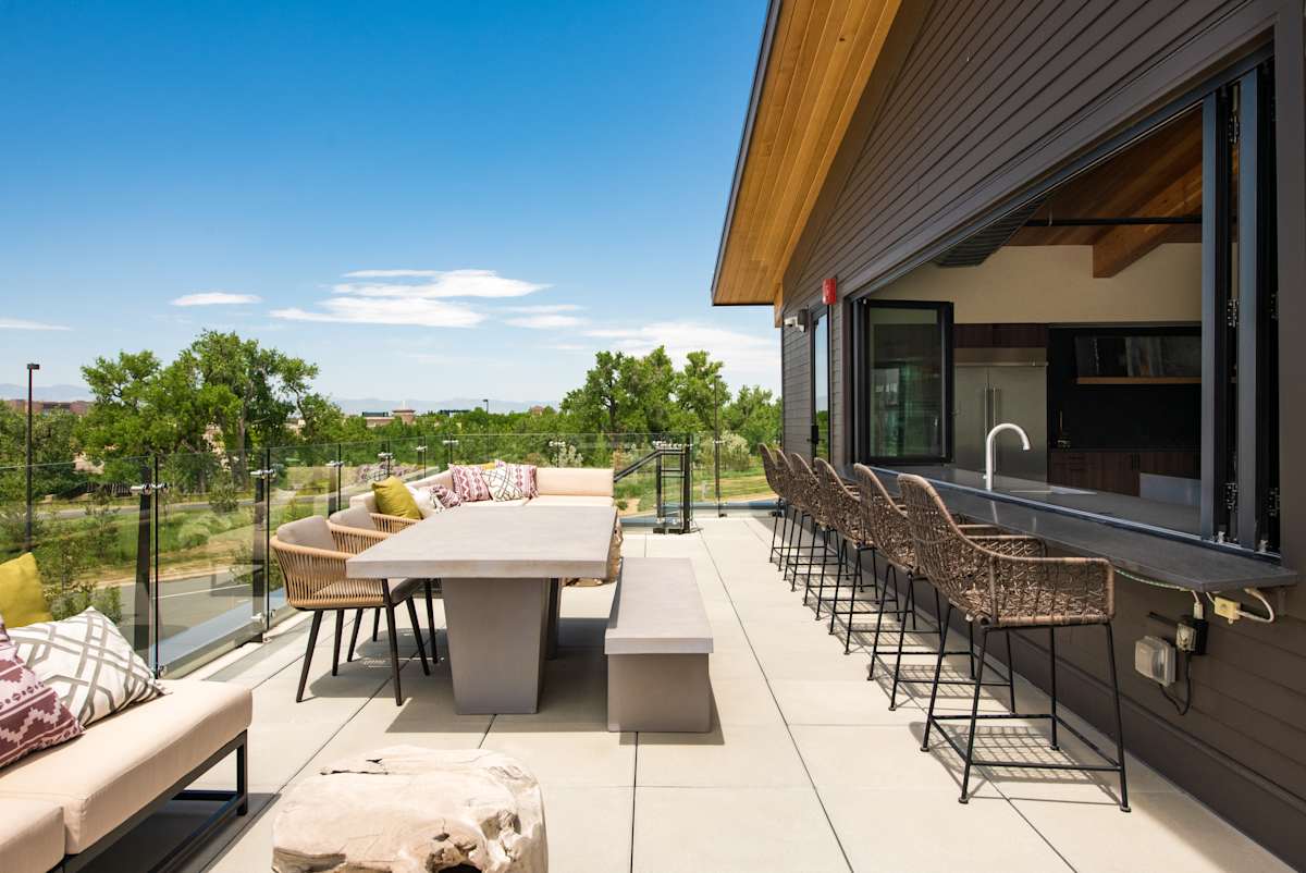 Railway Flats Apartments open air lounge dining space - Loveland, CO