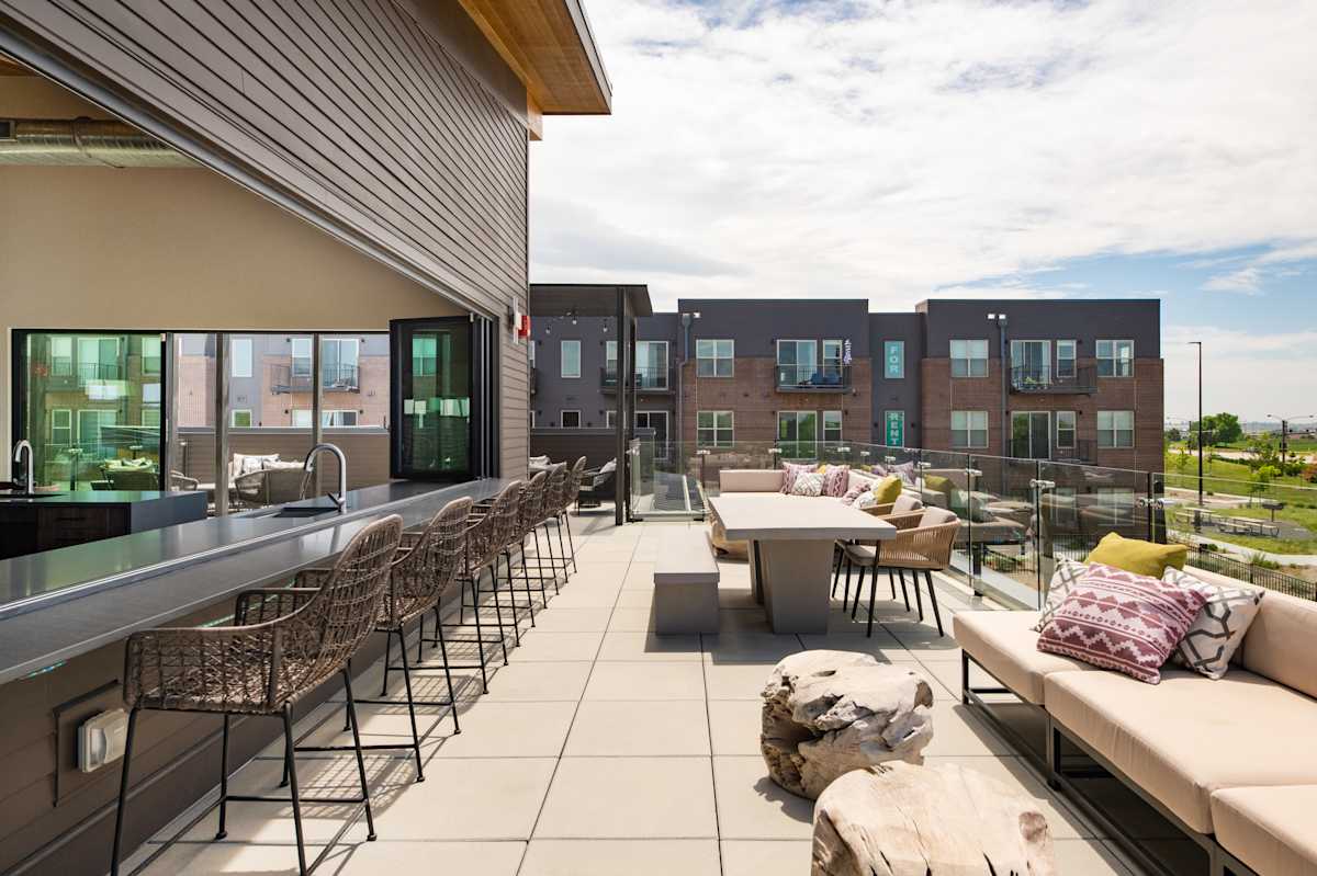 Railway Flats Apartments clubhouse outdoor lounge area - Loveland, CO