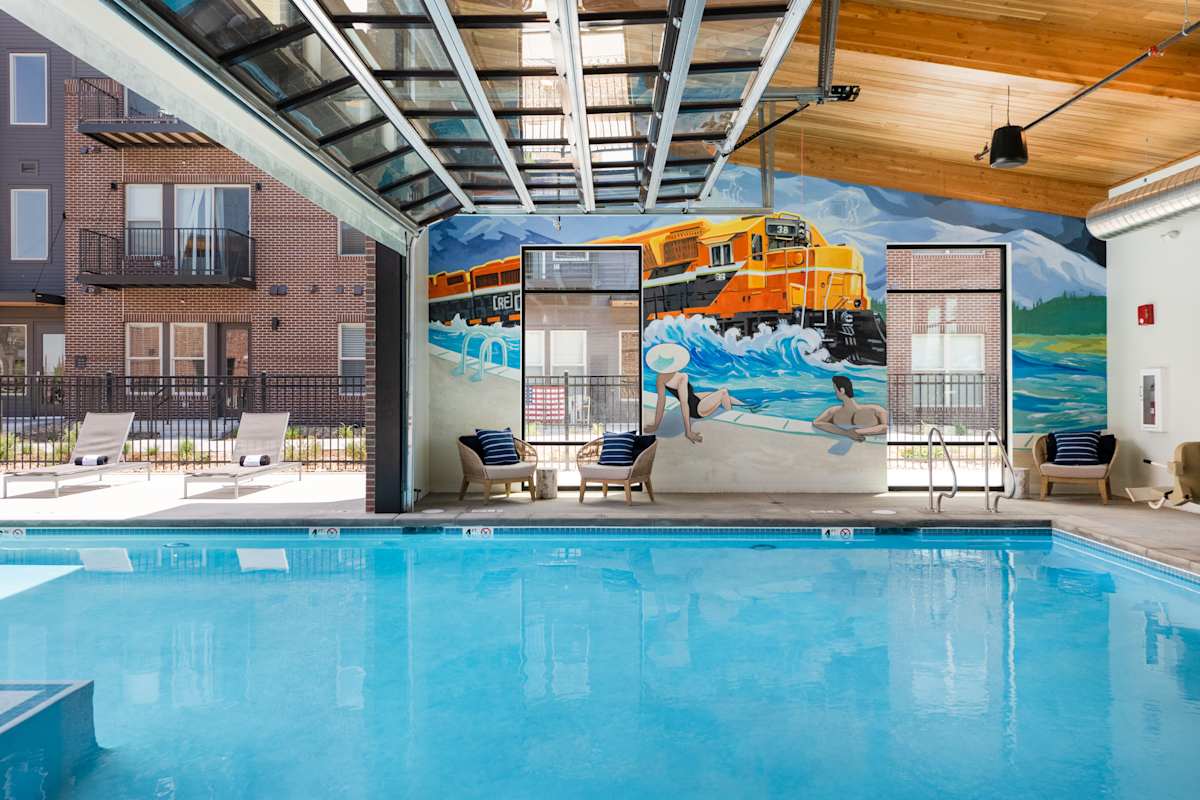 Railway Flats Apartments indoor pool seating mural - Loveland, CO