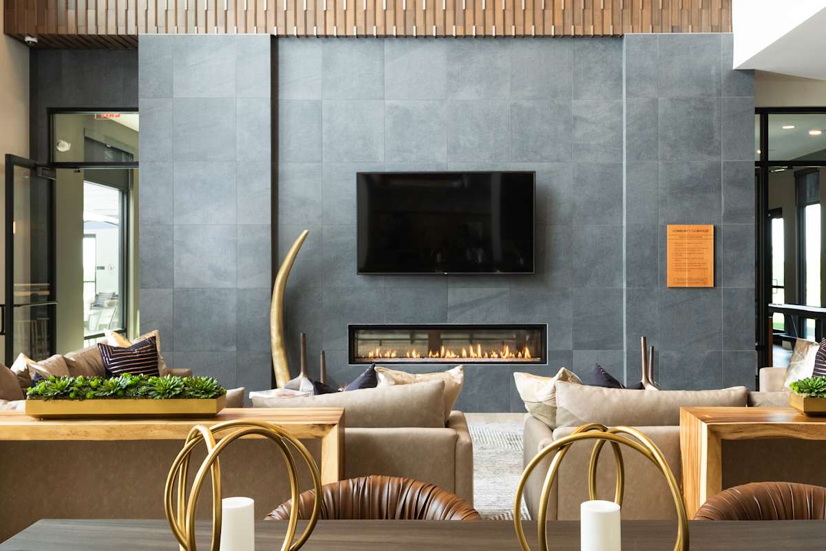 Railway Flats Apartments clubhouse fireplace lounge seating - Loveland, CO