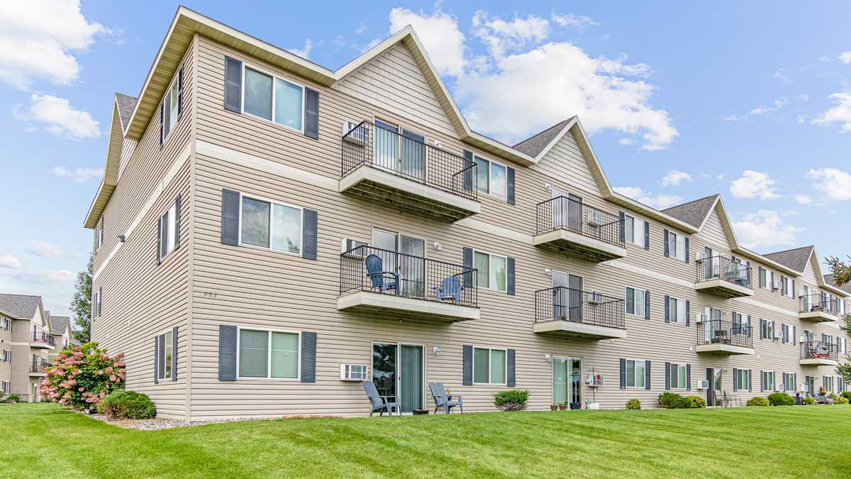 Rum River Apartments exterior building with balconies - Isanti, MN