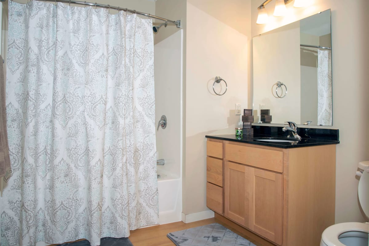 Southpoint Apartments bathroom with shower and vanity - Grand Forks, ND