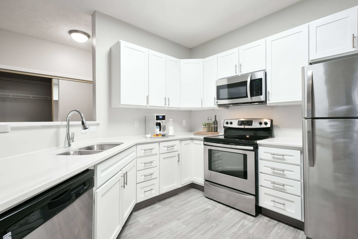 Lakeside Village Apartment Homes remodeled kitchen with white cabinetry - Lincoln, NE