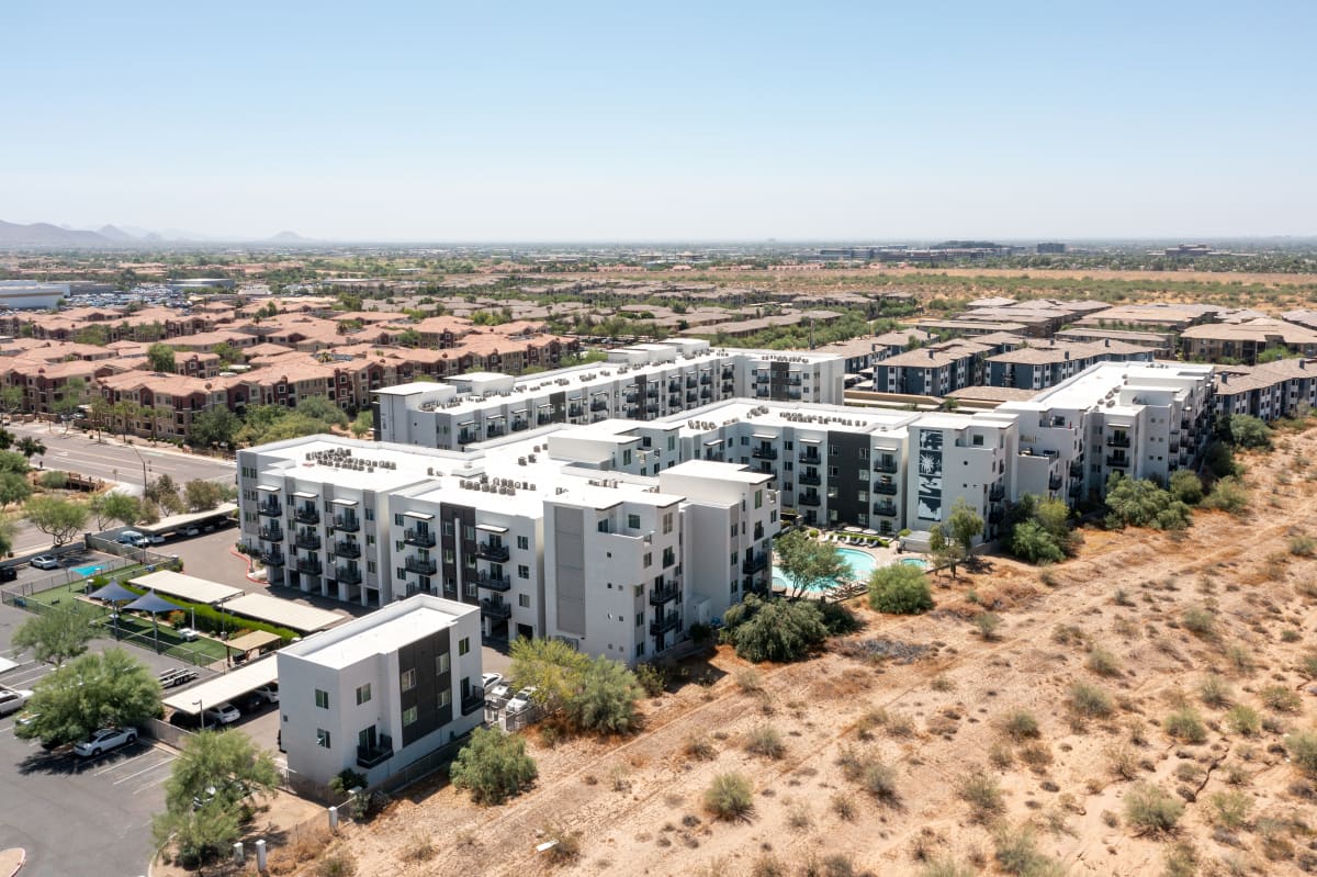 Aerial view of apartment buildings and pool at Slate Scottsdale.