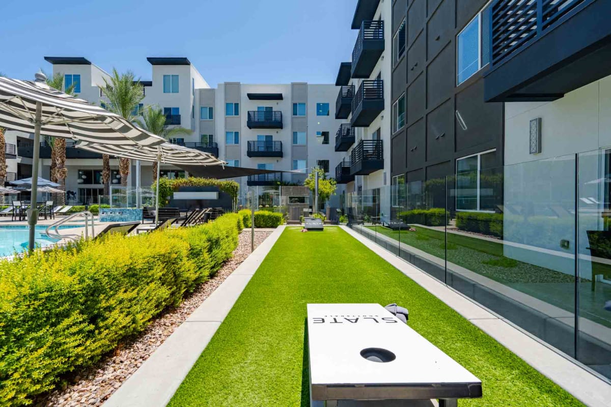 Outdoor cornhole area at Slate Scottsdale.