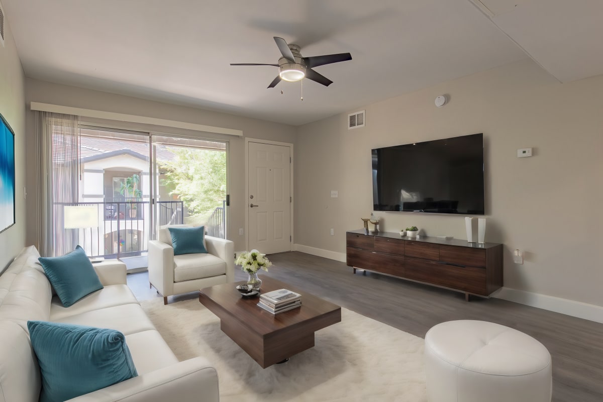 Furnished apartment living area shown — representative home at Agave Court.