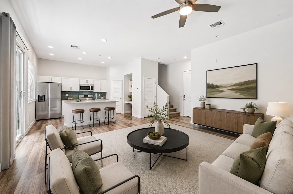Furnished apartment living area shown — representative home at Baseline on 16th.