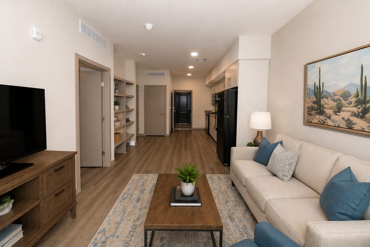 Furnished apartment living area shown — representative home at The Glendale Senior Apartments.