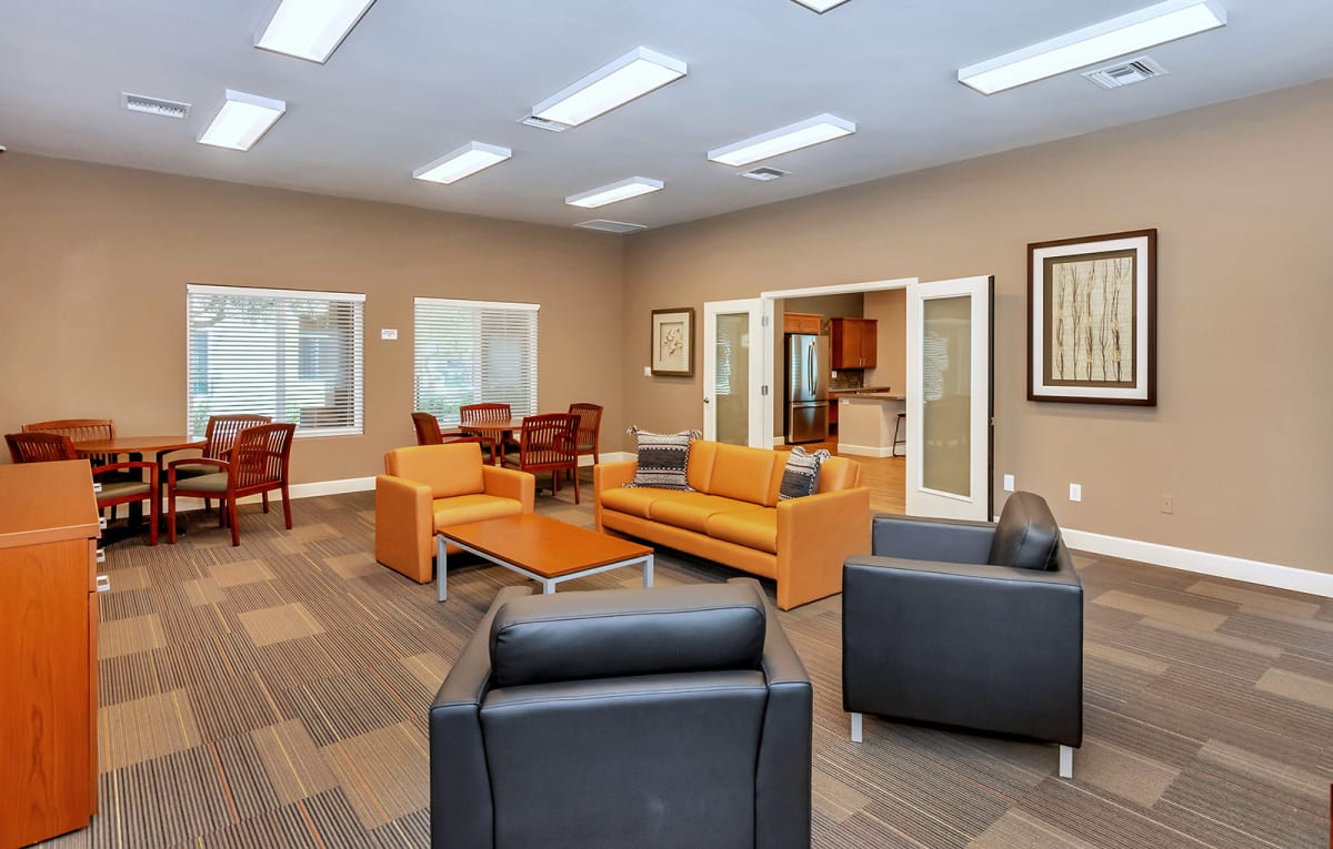 Community room with seating, tables and skylights.