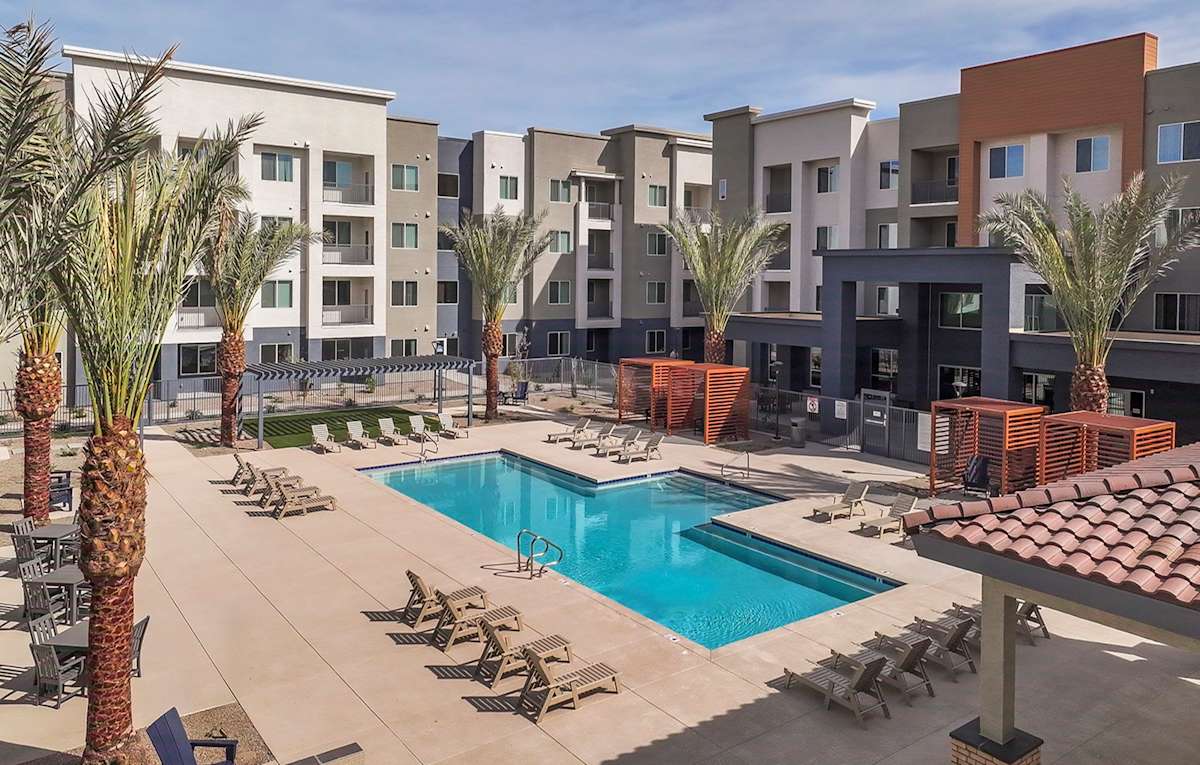Community swimming pool viewed from an upper floor — view 1 at Juniper Square 55+ Apartments.