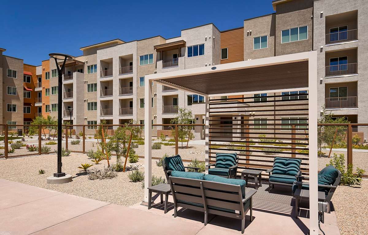 Suncrest Vista at Canyon Trails 55+ Apartments pool seating - Goodyear, AZ