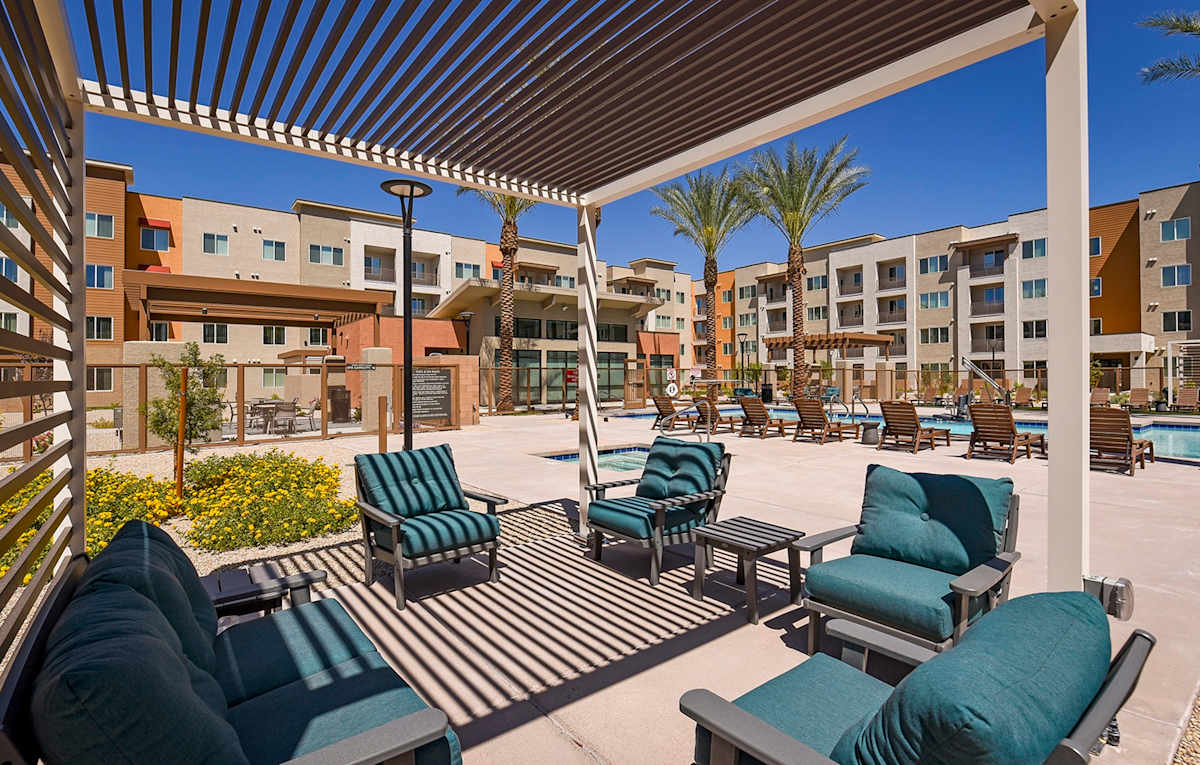 Suncrest Vista at Canyon Trails 55+ Apartments pool and lounge - Goodyear, AZ
