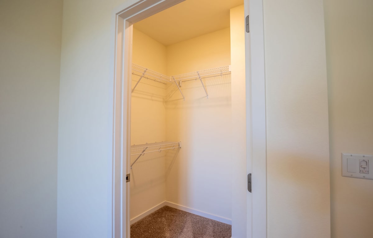 Walk-in closet — representative home at Vista Ridge Apartments.