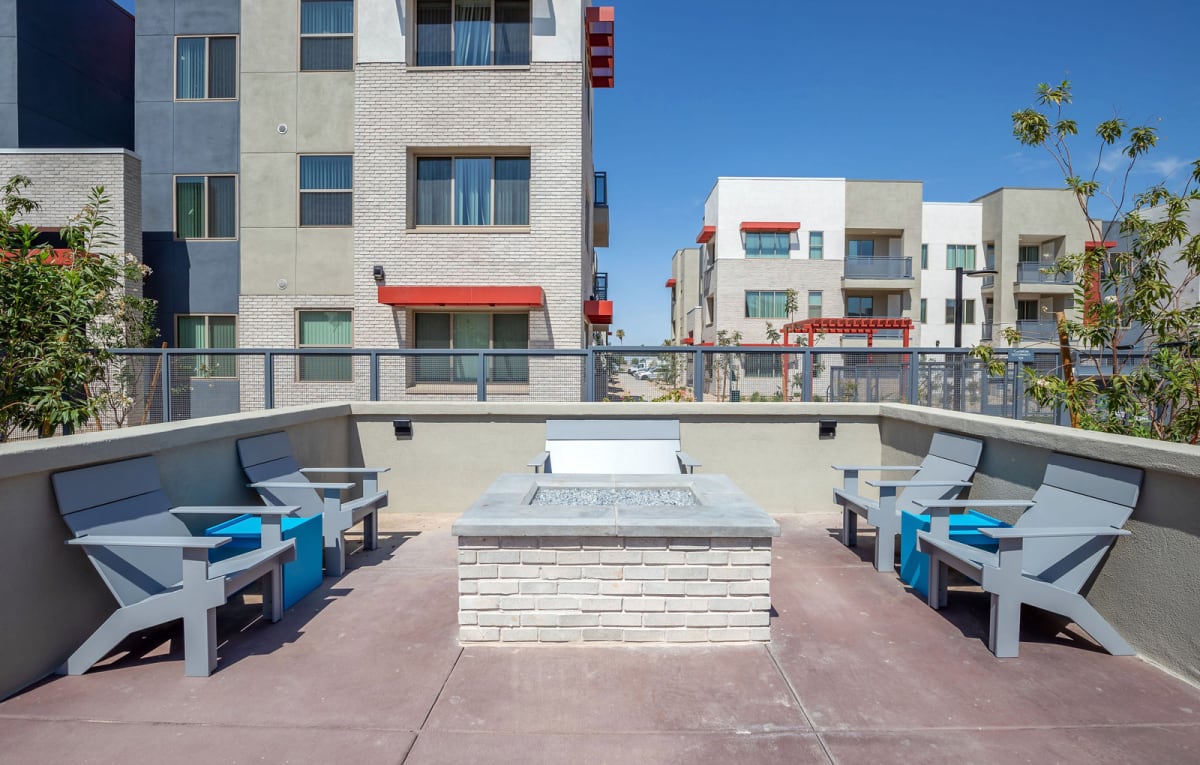 Outdoor fire pit and seating at Vista Ridge Apartments.