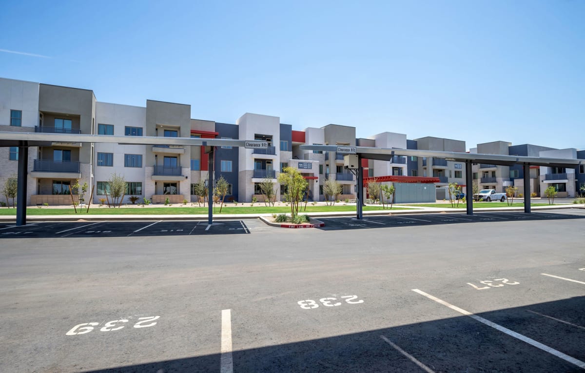 Parking area and building exterior at Vista Ridge Apartments.