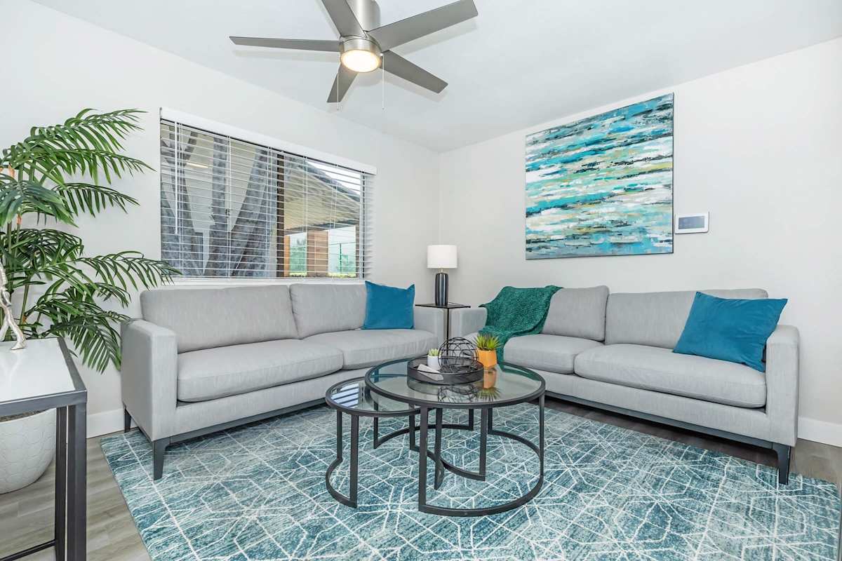 Furnished apartment living area shown — representative home at Solara.