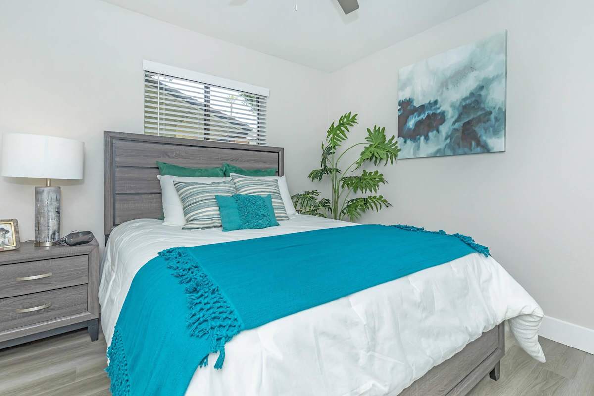 Furnished bedroom shown — representative home at Solara.