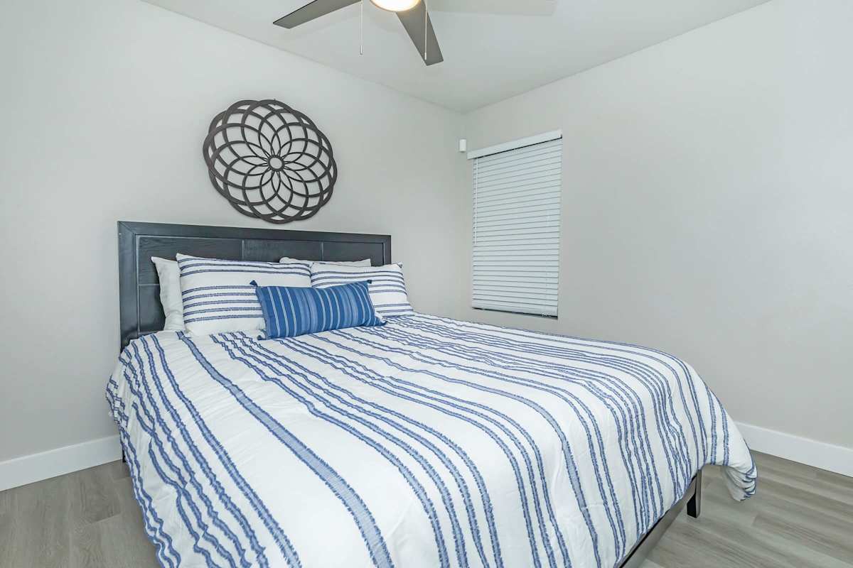 Furnished bedroom shown — representative home at Solara.