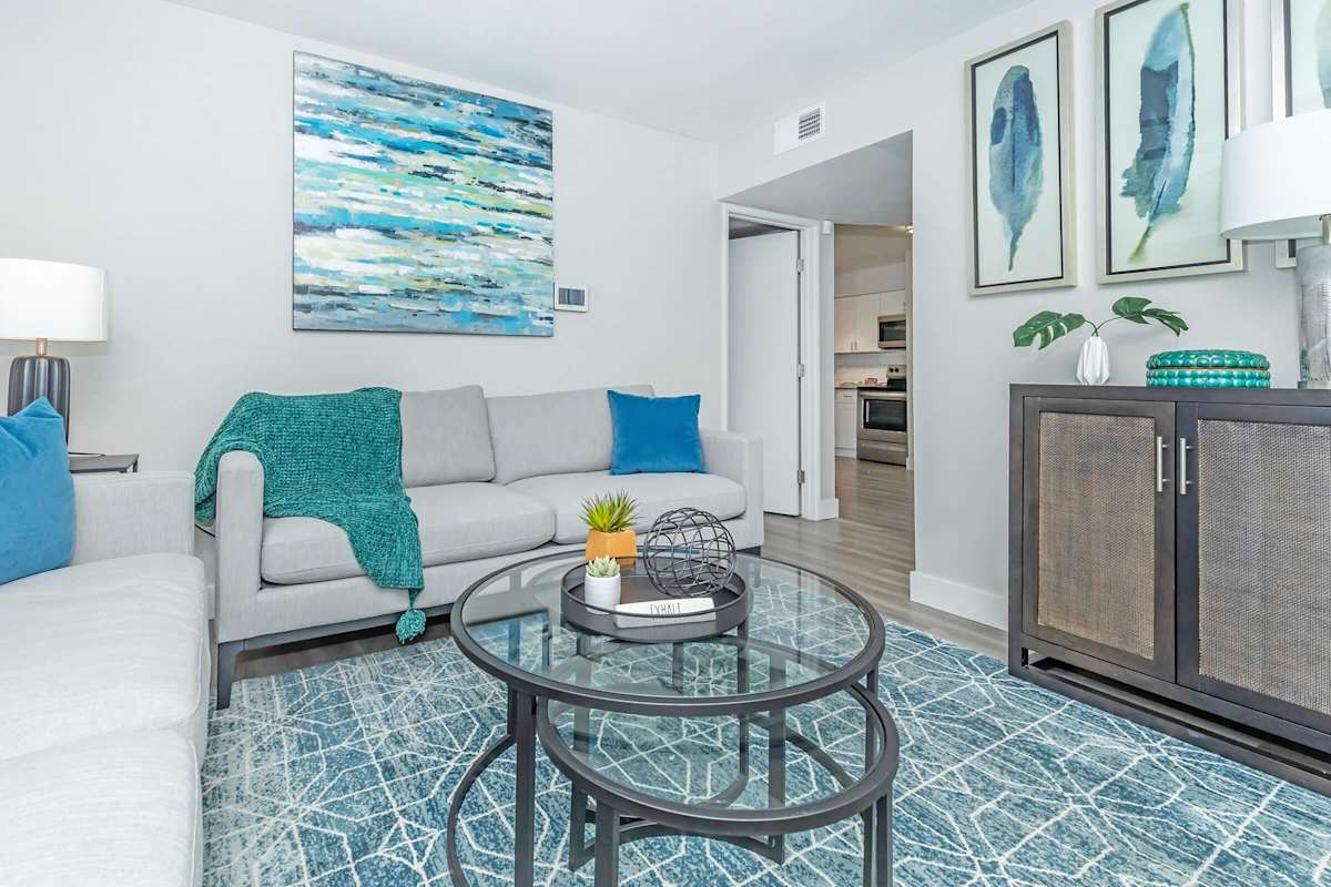Furnished apartment living area shown — representative home at Solara.