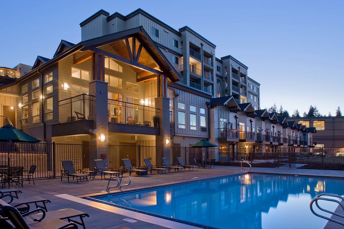 Echo Lake Apartments exterior at twilight with pool - Shoreline, WA