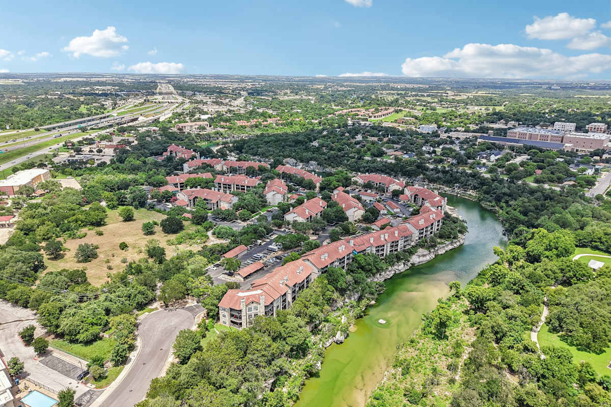 Waters Edge Apartment Homes aerial view along the river - Georgetown, TX