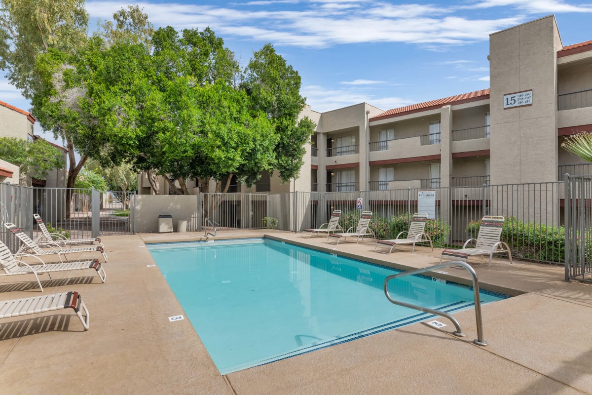Swimming pool framed by apartment buildings — view 2 at Glen Brae Apartments.