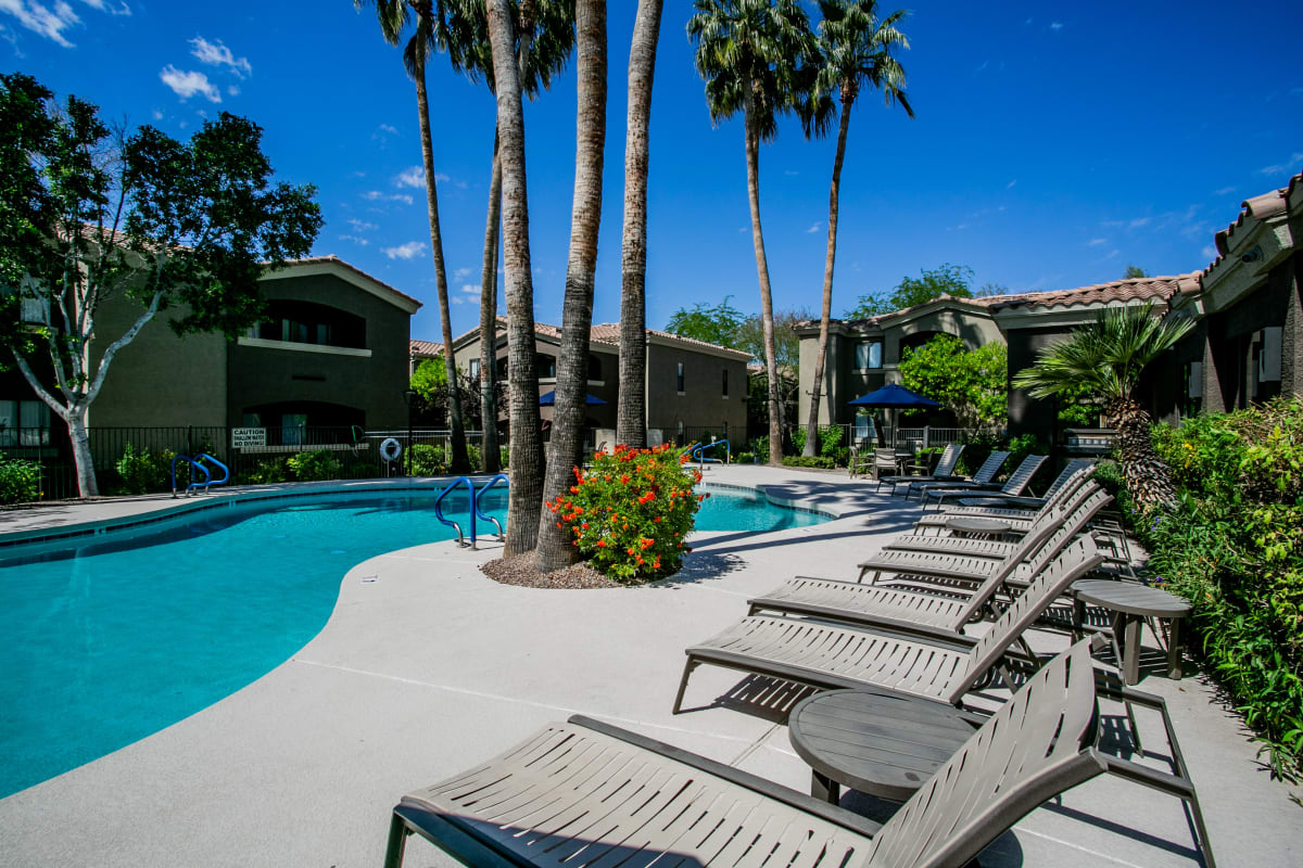 Pool and poolside area at RidgeGate Apartments.