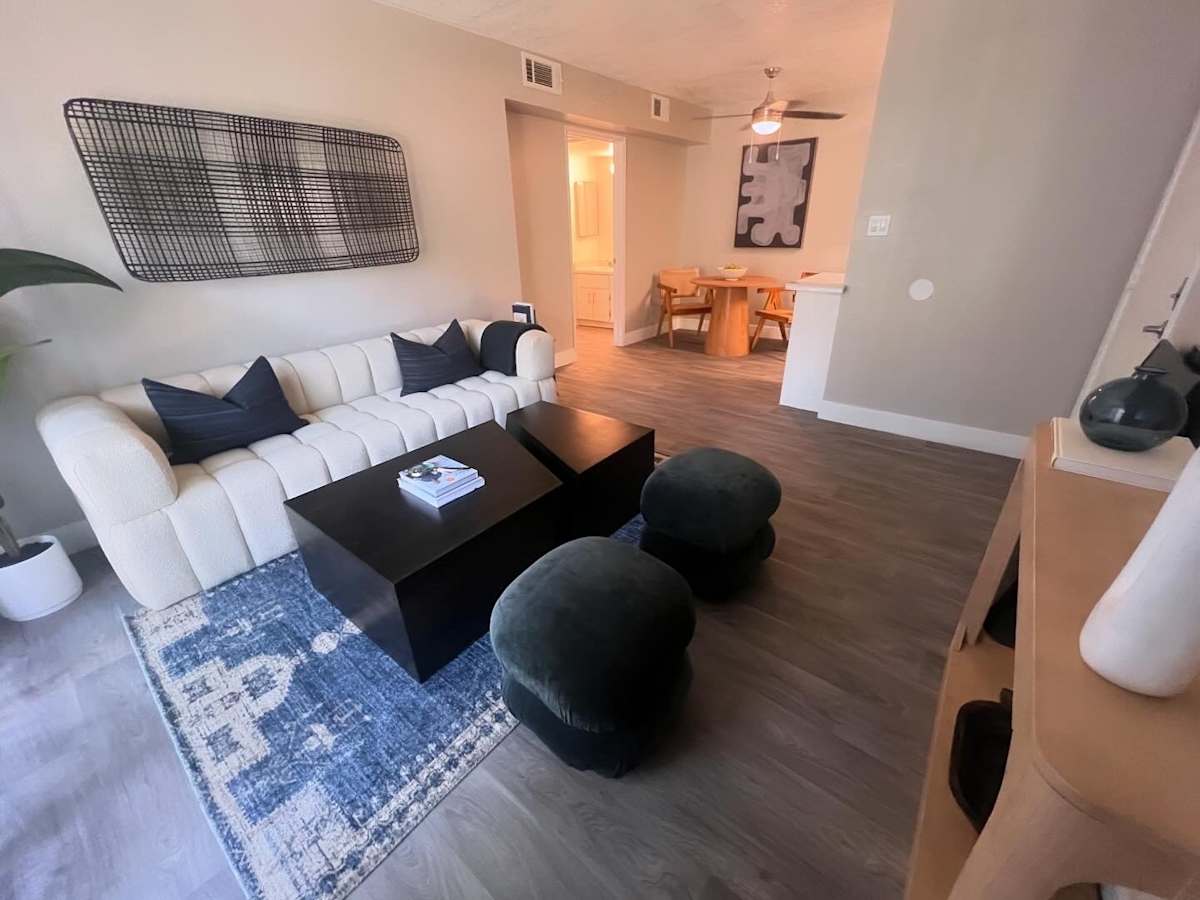Furnished apartment living area shown — representative home at North Mountain Apartments.