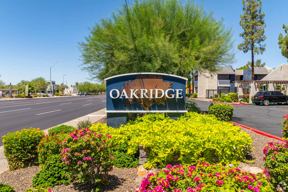 Oakridge entrance and landscaped grounds at Oakridge Apartments.