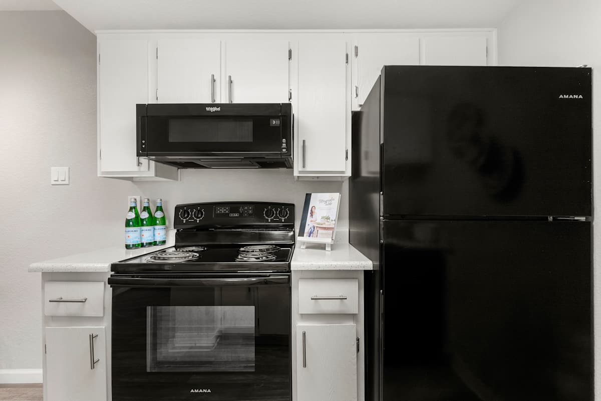 Kitchen stove and refrigerator at West 35th Apartments.