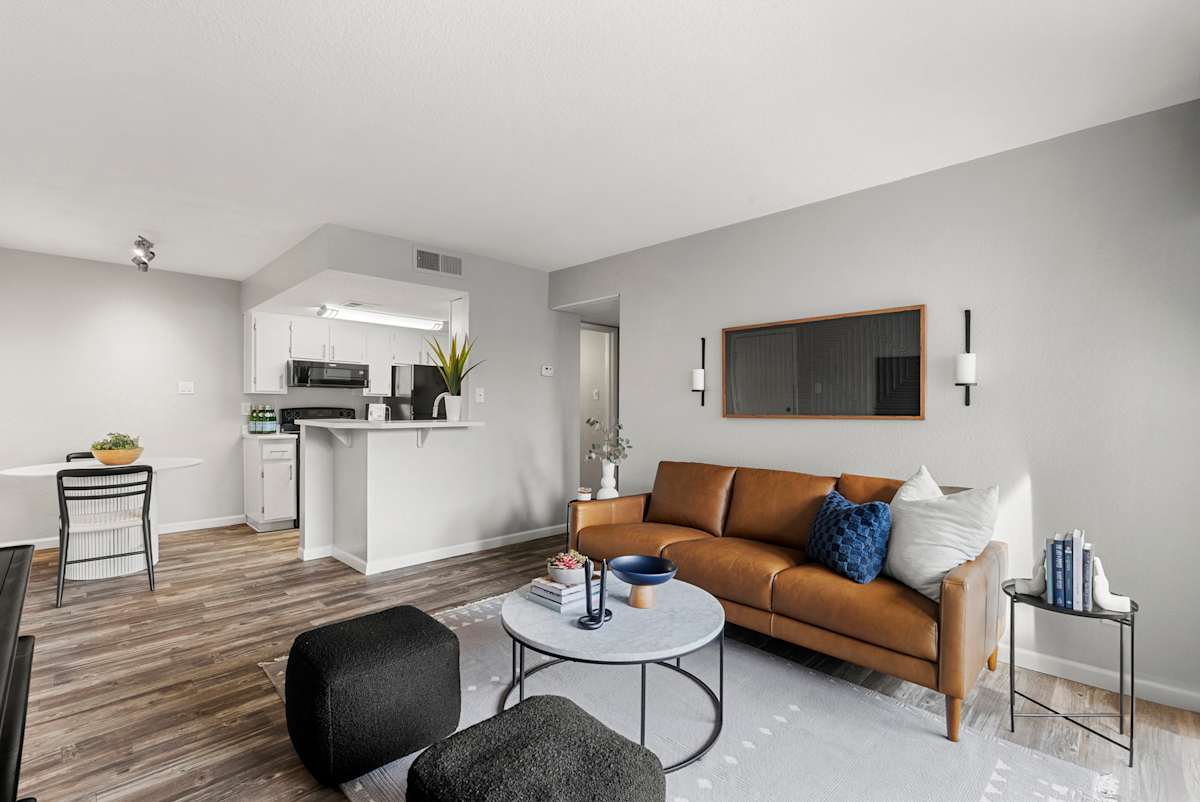 Furnished living room and kitchen at West 35th Apartments.