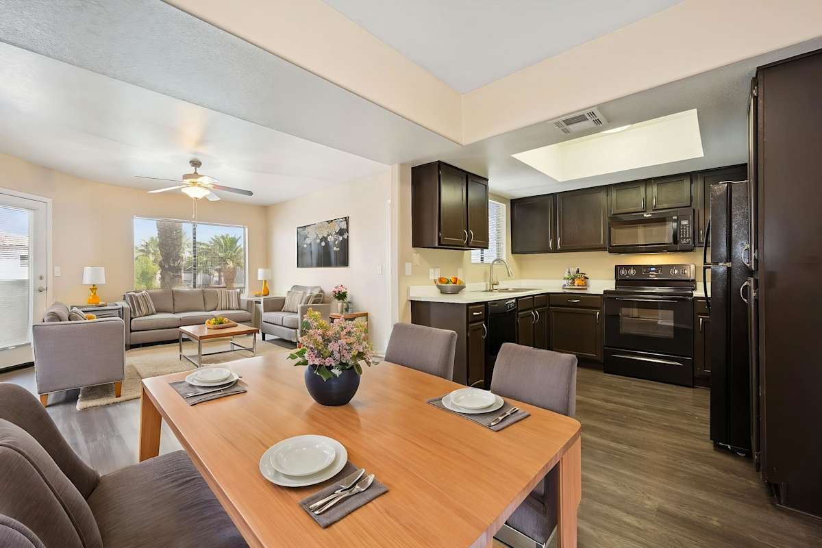 Furnished dining area shown — representative home at Sonoran Apartment Homes.