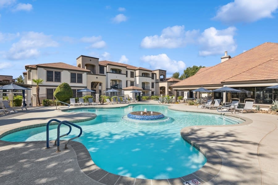 Pool and poolside area at Andante Apartments.