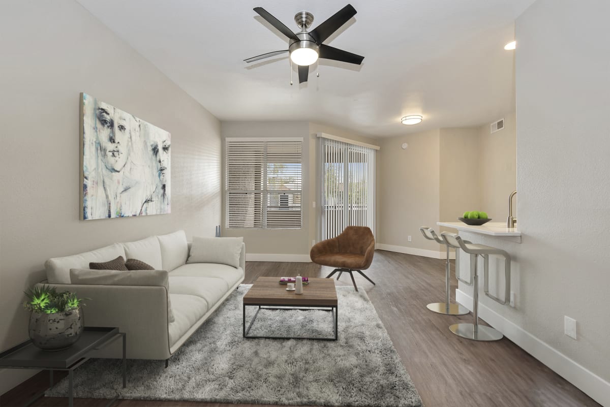 Furnished apartment living area shown — representative home at The Retreat Apartments.