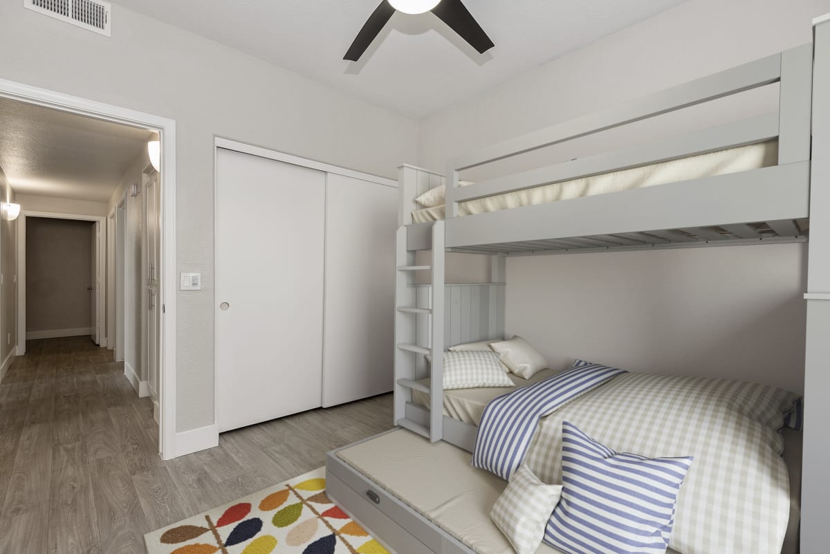 Furnished bedroom shown — representative home at The Retreat Apartments.