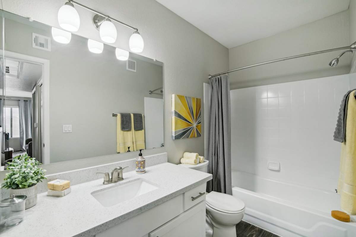 Apartment bathroom — representative home at Sonoran Apartment Homes.