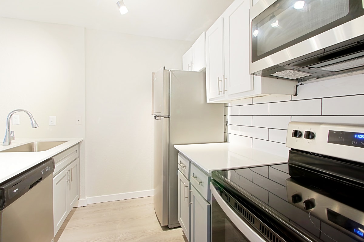 Apartment kitchen — representative home at Nightingale on 25th.