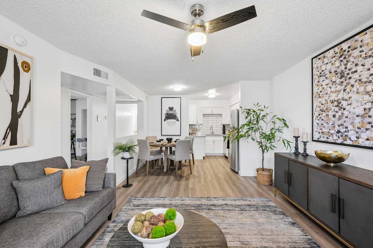 Furnished apartment living area shown — representative home at Ember at North Phoenix.