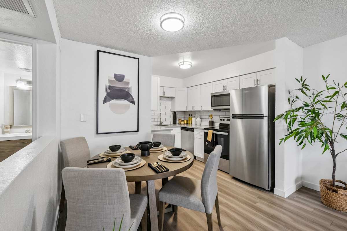 Furnished dining area shown — representative home at Ember at North Phoenix.