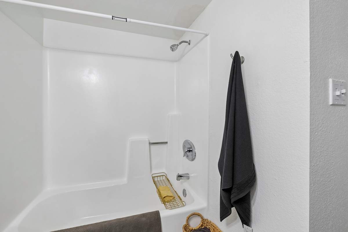 Apartment bathroom — representative home at Ember at North Phoenix.