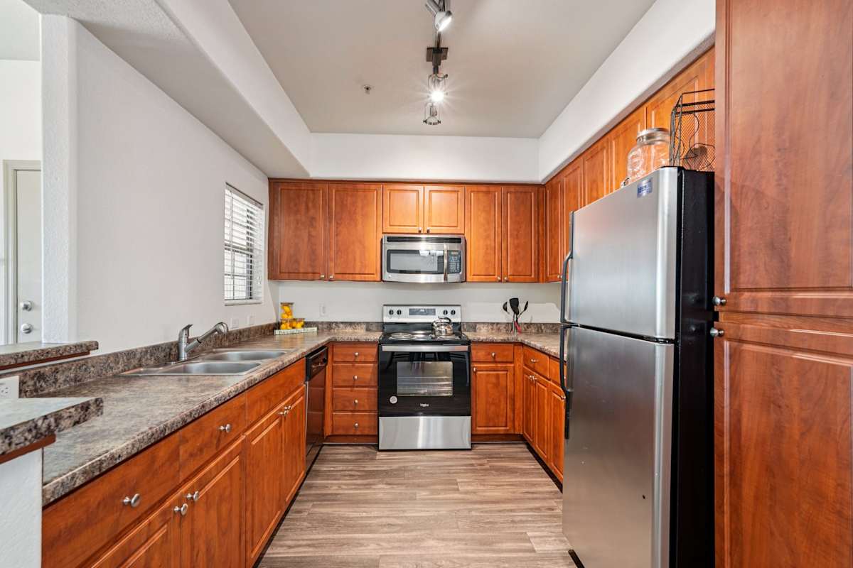 Apartment kitchen — representative home at Del Mar Apartments.